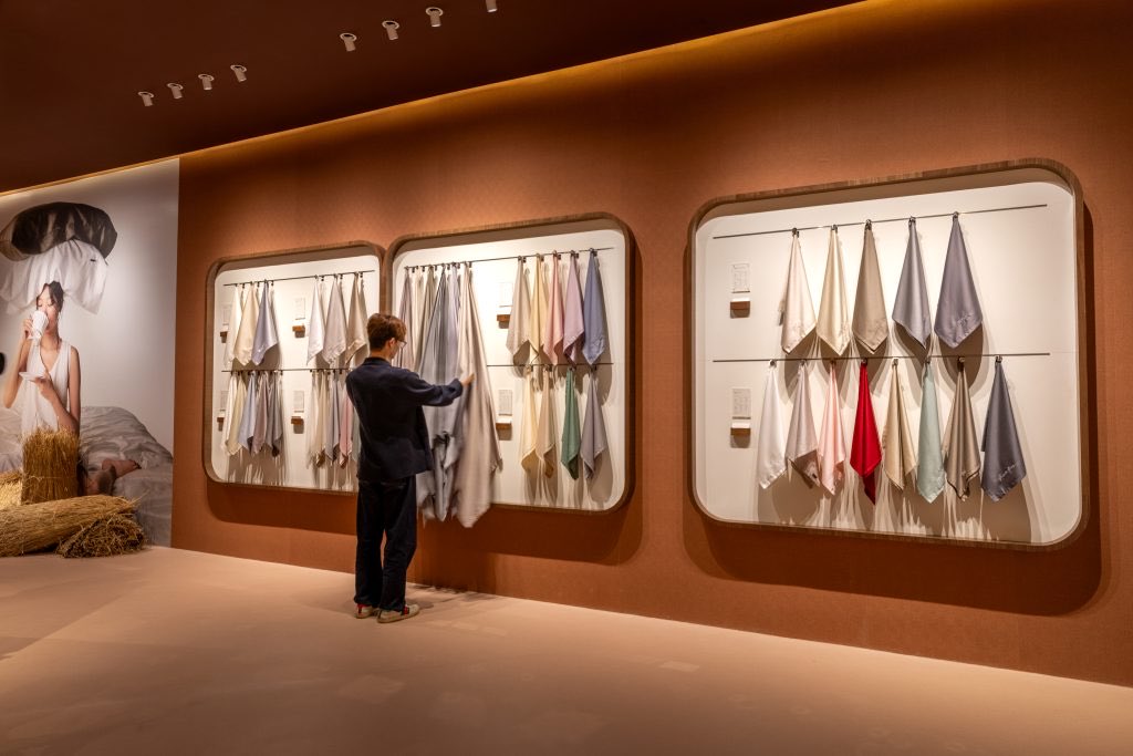 The GAIAS store at IOI Mall Damansara — a terracotta gallery of rounded frames holding the fabric library