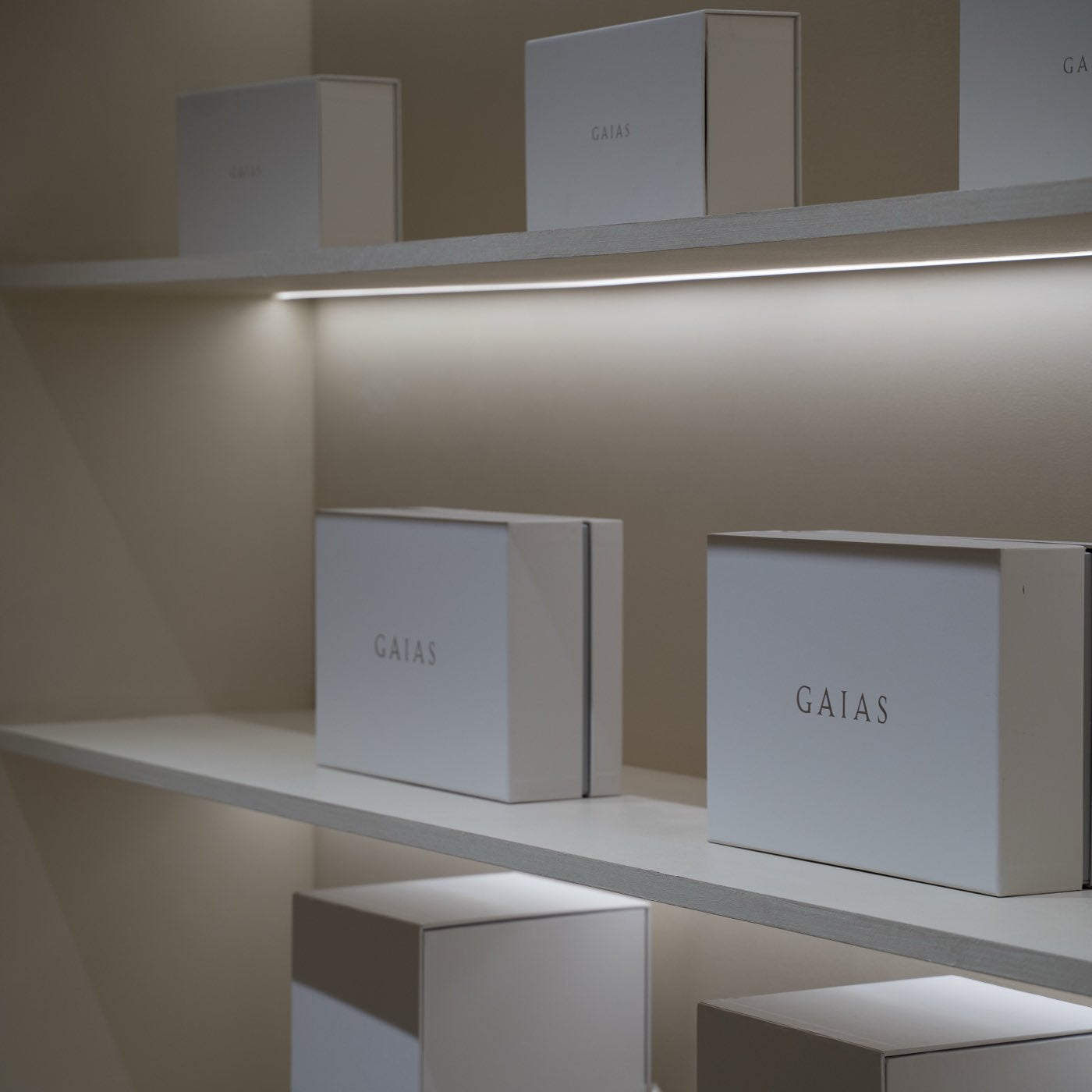 GAIAS gift boxes on softly lit shelving