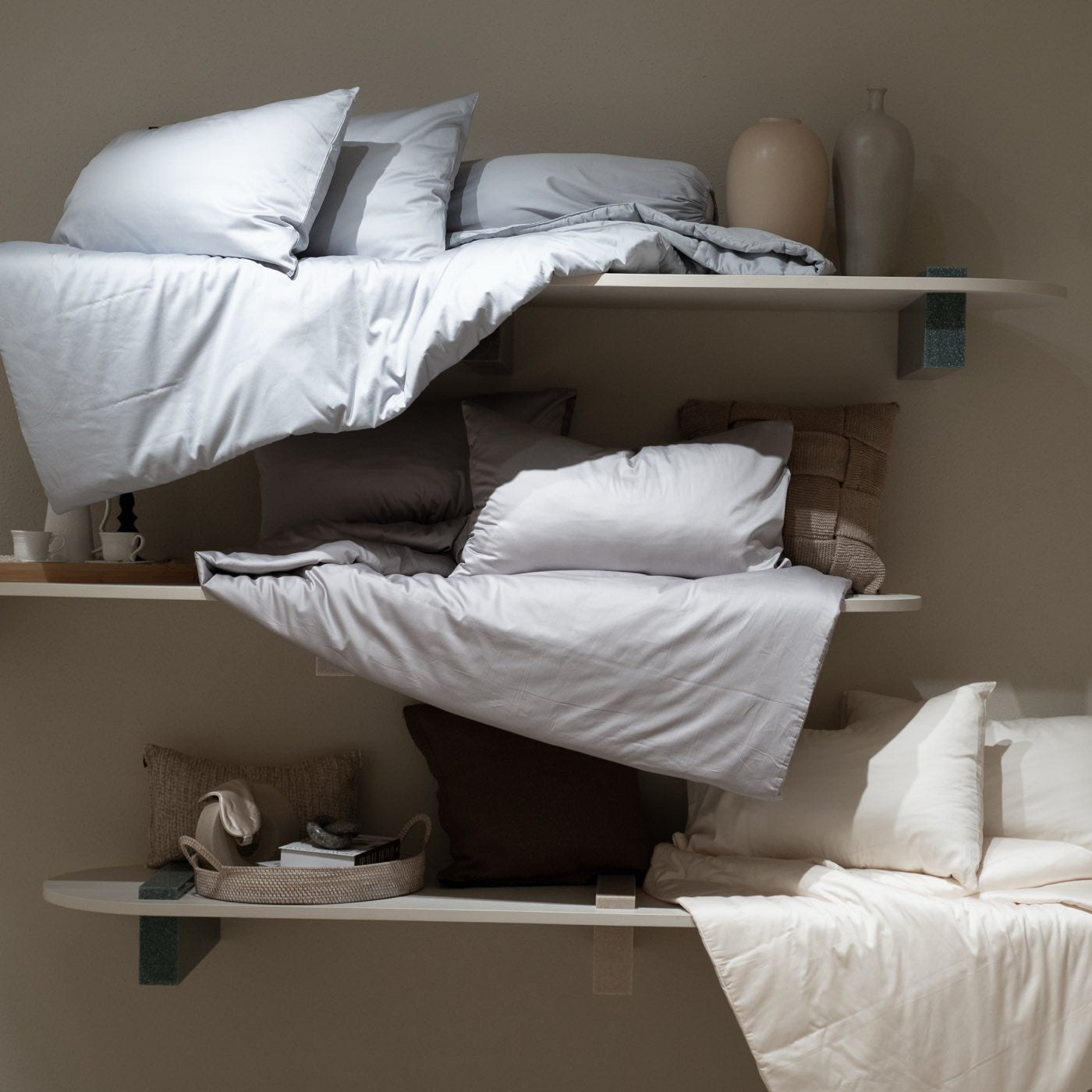 A bed shown in pieces on cantilevered shelves